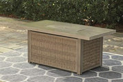 Outdoor Ashley Furniture Beachcroft fire pit table with black metal frame and stone top, perfect for outdoor gatherings.