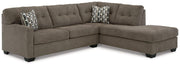Ashley Furniture Mahoney living room set with a sofa and armchair in a modern design, featuring neutral upholstery and wooden legs.