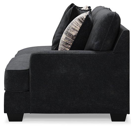 Ashley Furniture Lavernett living room set with plush sofa and coordinating armchair in a modern living space.
