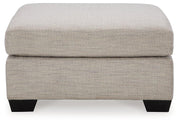 Ashley Furniture Mahoney Living Room Set with sofa and armchair in a modern living room setting.