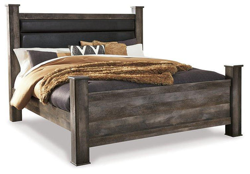 Ashley Furniture Wynnlow Bed in a modern bedroom setting with a sleek wooden frame and comfortable bedding.