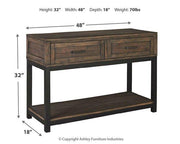 Ashley Furniture Johurst sofa/console table featuring a sleek wooden design with a smooth surface and sturdy legs.