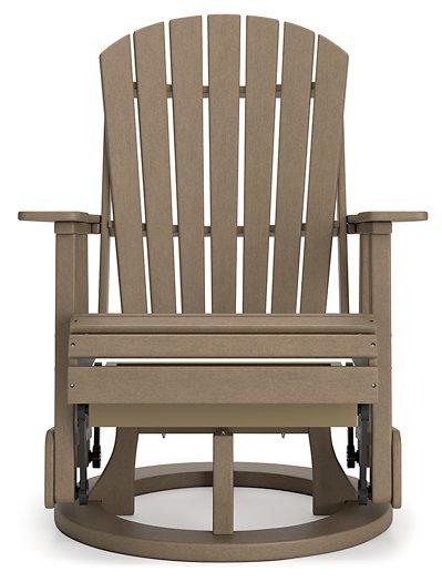 Ashley Furniture Hyland Wave outdoor swivel glider chair with a cushioned seat and curved back for comfortable outdoor dining.