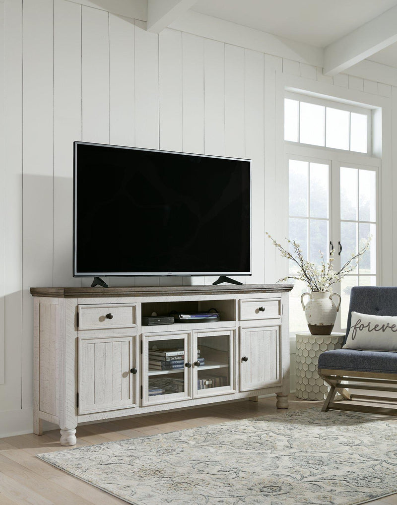 Ashley Furniture Havalance TV Stand with open shelves and storage drawers, modern wood finish for living room entertainment center.