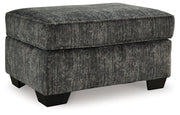 Ashley Furniture Lonoke living room set featuring a sofa and armchair with neutral fabric upholstery and modern design.