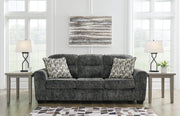 Ashley Furniture Lonoke living room set featuring a sofa and loveseat with plush cushions and neutral fabric upholstery.