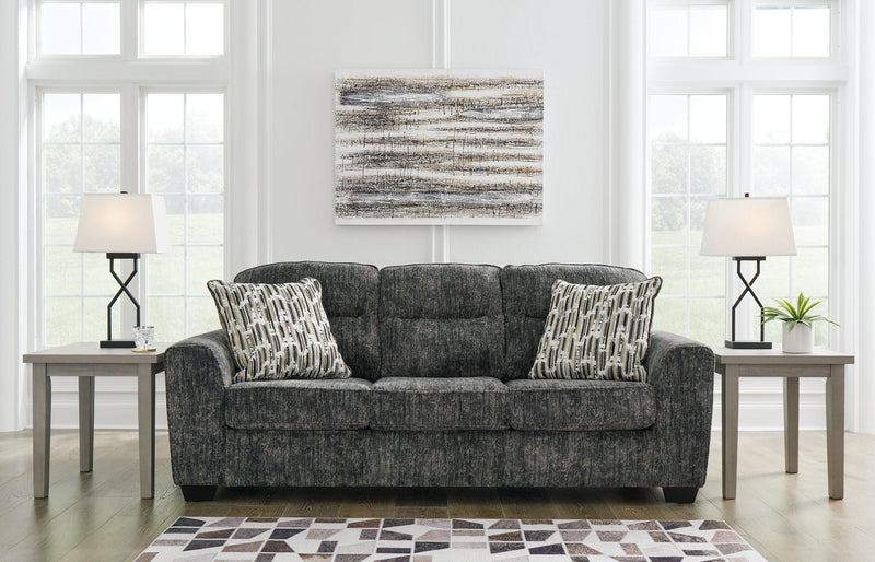Ashley Furniture Lonoke living room set featuring a sofa and loveseat with plush cushions and neutral fabric upholstery.
