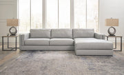 Ashley Furniture Amiata sectional with chaise, featuring plush fabric upholstery and modern design in a spacious living room setting.