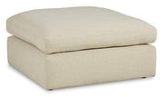 Ashley Furniture Elyza oversized accent ottoman with plush fabric and modern design, shown as a versatile living room piece.