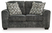 Ashley Furniture Lonoke living room set with plush sofas and coordinated coffee table in a modern home setting.