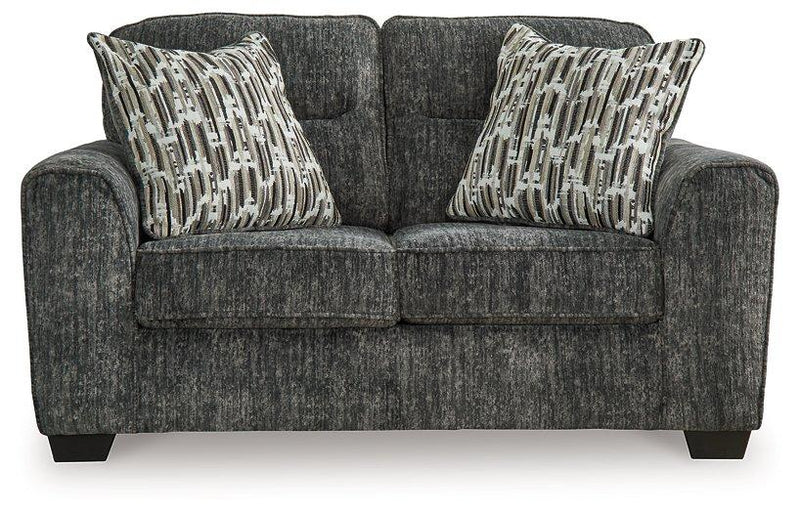 Ashley Furniture Lonoke living room set with plush sofas and coordinated coffee table in a modern home setting.