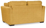 Ashley Furniture Keerwick living room set with sofa and matching armchair, featuring neutral upholstery and modern design.