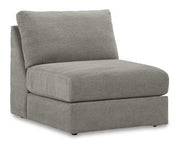 Ashley Furniture Avaliyah sectional sofa with plush cushions and modern design, shown in a spacious living room setting.