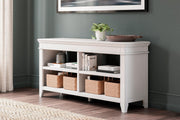 Ashley Furniture Kanwyn credenza curio with glass doors and wooden shelves, showcasing a stylish storage and display piece.