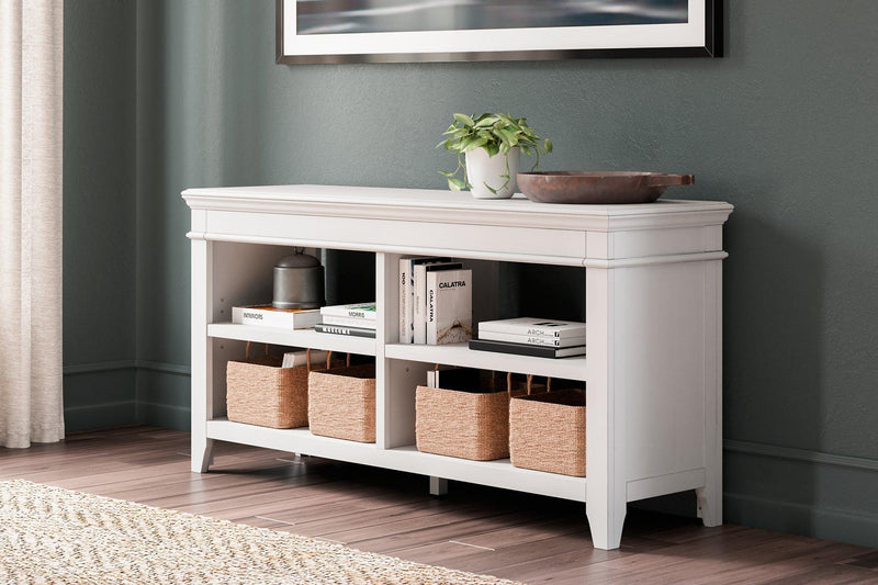Ashley Furniture Kanwyn credenza curio with glass doors and wooden shelves, showcasing a stylish storage and display piece.