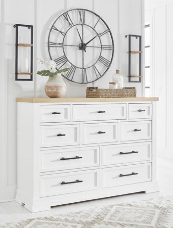 Ashbryn dresser by Ashley Furniture featuring a modern wooden design with multiple drawers and sleek hardware.