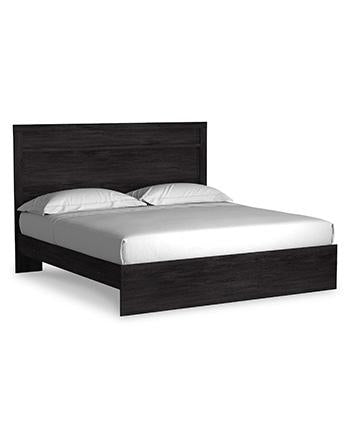 Ashley Furniture Belachime bedroom set with matching bed frame, dresser, and nightstands in a modern bedroom setting.