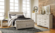 Ashley Furniture Bellaby bed with two storage drawers, featuring a sturdy frame and sleek design for modern bedroom storage.