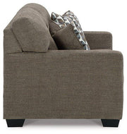 Ashley Furniture Mahoney living room set with sofa and loveseat in a modern fabric design, arranged in a contemporary living space.