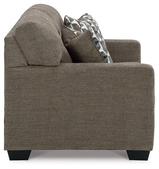 Ashley Furniture Mahoney living room set with sofa and loveseat in a modern fabric design, arranged in a contemporary living space.