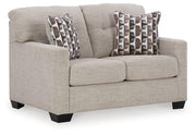Ashley Furniture Mahoney living room set featuring a sofa, loveseat, and armchair in a modern design with neutral upholstery.