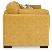Ashley Furniture Keerwick living room set with sofa and loveseat in a modern design, shown in a cozy home setting.