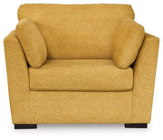 Ashley Furniture Keerwick living room set with sofa and armchair in a cozy, modern living room setting.