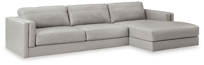 Ashley Furniture Amiata sectional with chaise, featuring plush cushions and fabric upholstery, shown in a modern living room setting.