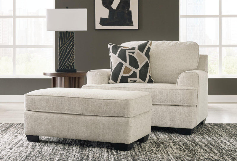 Ashley Furniture Heartcort living room set featuring a sofa and armchair with neutral upholstery and modern design.