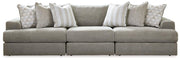 Ashley Furniture Avaliyah sectional sofa with plush cushions and modern design, shown in a living room setting.