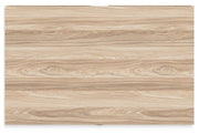 Ashley Furniture Battelle chest of drawers with six spacious wooden drawers in a modern bedroom setting