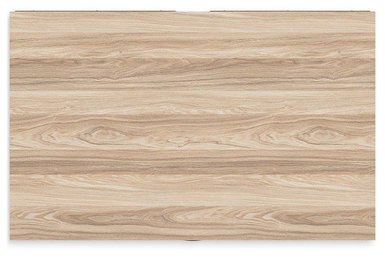 Ashley Furniture Battelle chest of drawers with six spacious wooden drawers in a modern bedroom setting