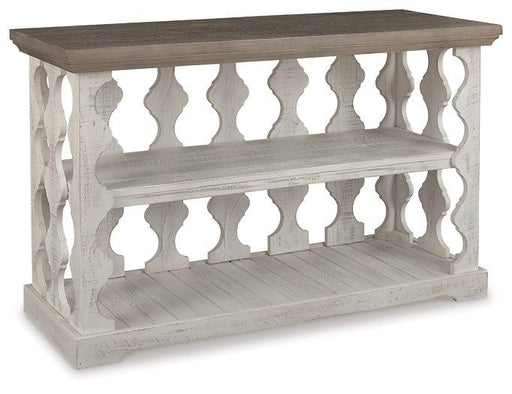 Ashley Furniture Havalance sofa table featuring a sleek console design with a dark wood finish and modern metal accents.