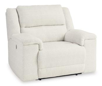 Ashley Furniture Keensburg oversized power recliner with plush upholstery and padded armrests, shown in a cozy living room setting.