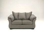 Ashley Furniture Darcy living room set featuring a sofa, loveseat, and armchair with neutral fabric upholstery.