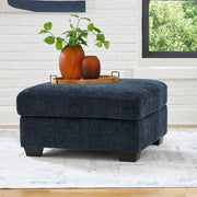 A large Ashley Furniture Aviemore oversized accent ottoman with plush fabric and tufted top, ideal for living room decor.
