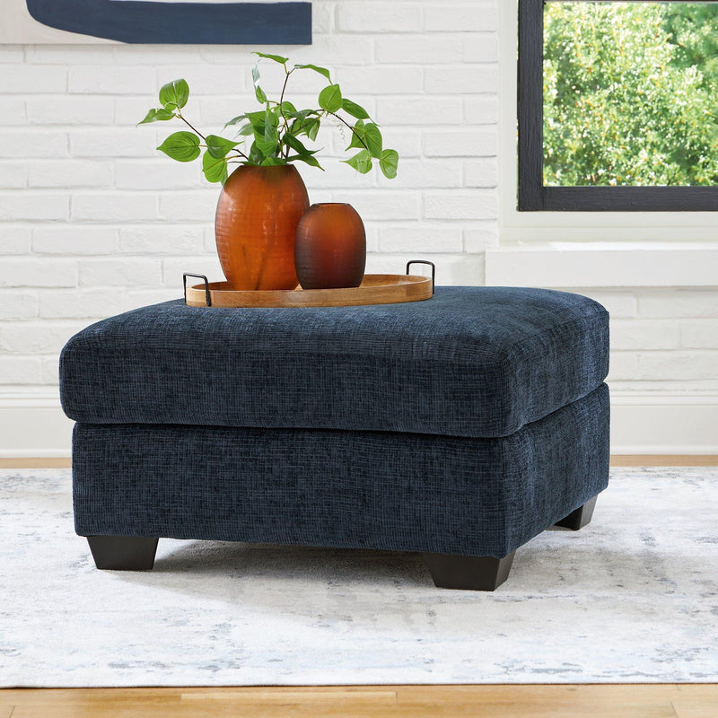 A large Ashley Furniture Aviemore oversized accent ottoman with plush fabric and tufted top, ideal for living room decor.