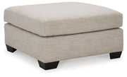 Ashley Furniture Mahoney living room set featuring a sofa, loveseat, and armchair with neutral upholstery and modern design.