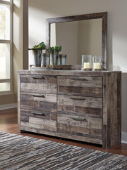 Derekson dresser with matching mirror from Ashley Furniture, featuring a modern wooden design with sleek handles.
