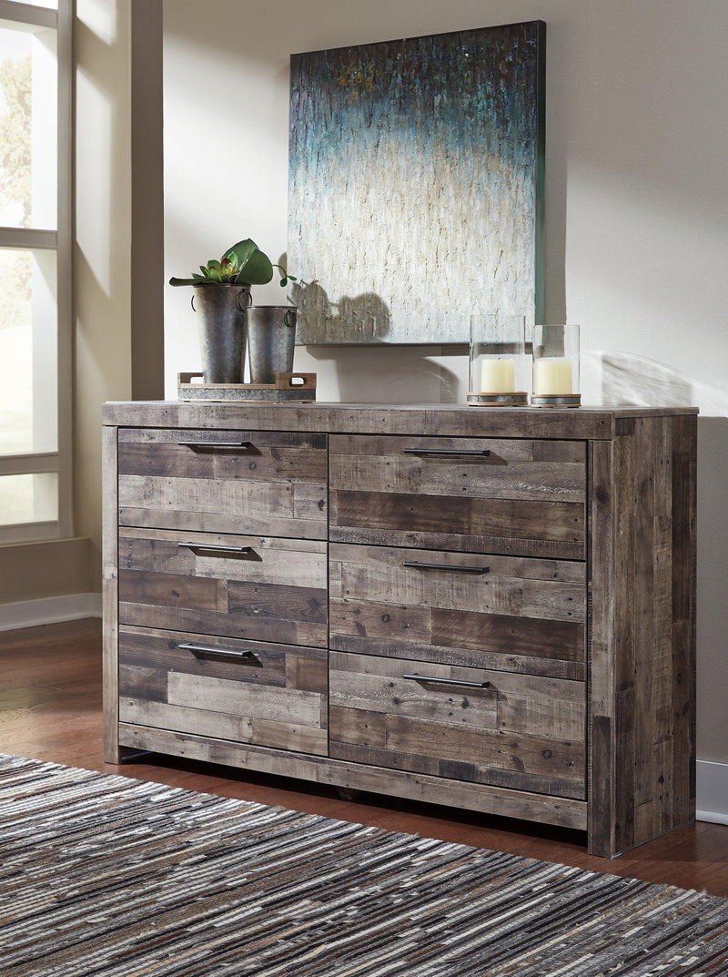 Ashley Furniture Derekson Dresser with multiple drawers and a dark wood finish, showcasing a modern bedroom storage solution.