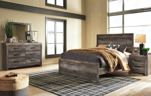 Ashley Furniture Wynnlow bedroom set showing a modern bed frame, matching nightstands, and dresser in a stylish bedroom setting.