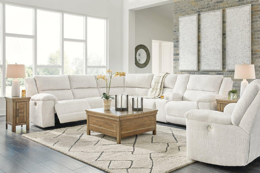 Ashley Furniture Keensburg living room set with sofa and loveseat in a modern design, featuring neutral upholstery and plush cushions.