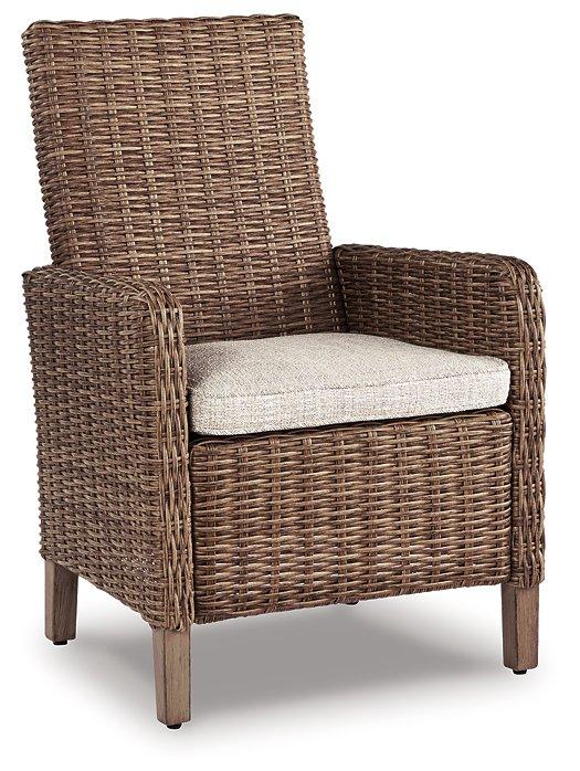 Set of two Ashley Furniture Beachcroft outdoor arm chairs with cushions, ideal for patio or garden seating.