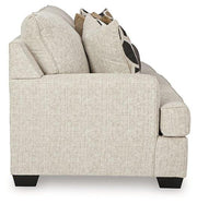 Ashley Furniture Heartcort living room set featuring a sofa and loveseat with plush cushions and modern design in a stylish living space.