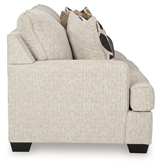 Ashley Furniture Heartcort living room set featuring a sofa and loveseat with plush cushions and modern design in a stylish living space.