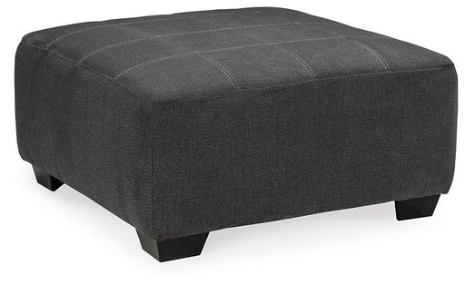 Oversized Ashley Furniture Ambee accent ottoman with plush fabric and modern design, shown in a living room setting.
