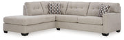 Ashley Mahoney Living Room Set with sofa and armchair in a modern, neutral fabric, featuring plush cushions and wooden legs.