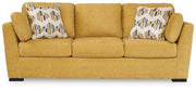 Ashley Furniture Keerwick living room set with sofa and loveseat in a modern design, shown in a cozy living space.