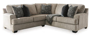 Ashley Furniture Bovarian living room set featuring a sofa, loveseat, and armchair with neutral upholstery and modern design.