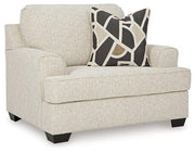 Ashley Furniture Heartcort living room set with a sofa and armchair featuring neutral upholstery and modern design.